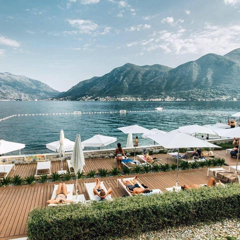 Beach club loungers by the water