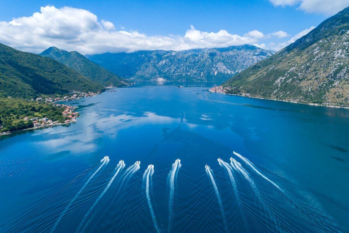 Speedboats cutting across the Bay of Kotor